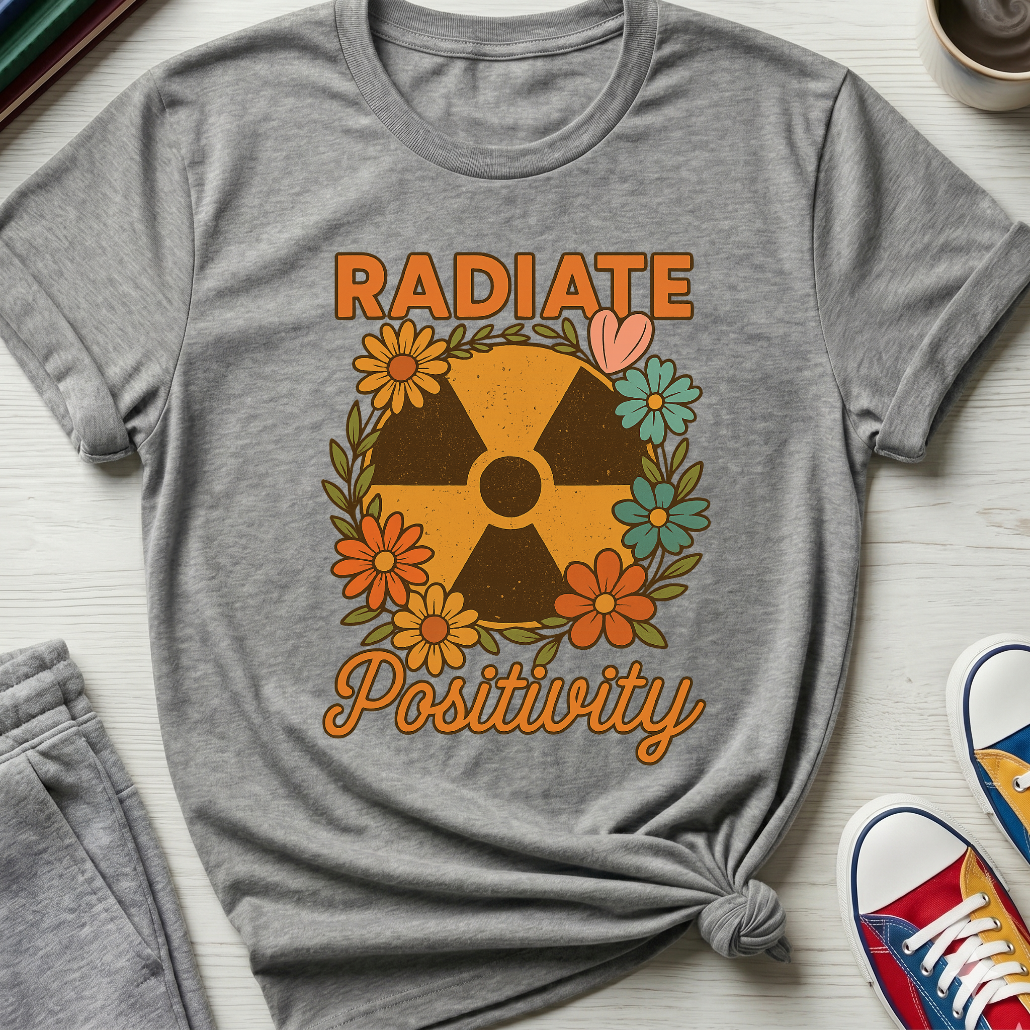 Radiate Positivity Radiation Symbol with Daisies | T-Shirt