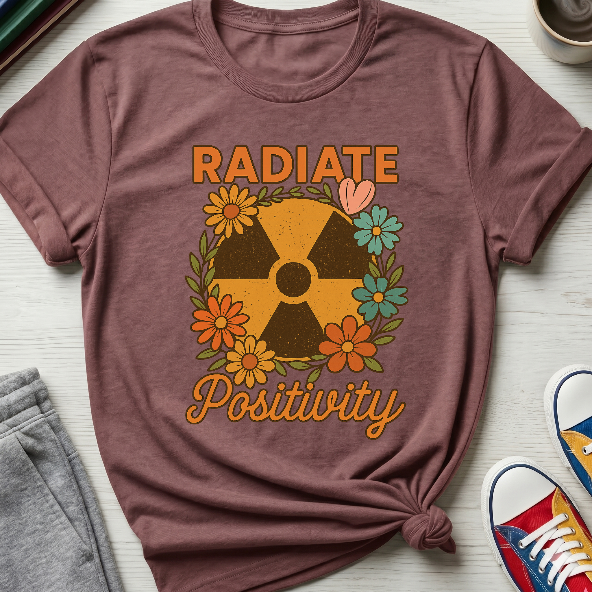 Radiate Positivity Radiation Symbol with Daisies | T-Shirt